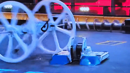 Robot combat vehicles compete in arena match