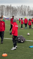 Youth soccer practice near frozen Kama River in Chaikovsky