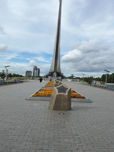 Around the Cosmonautics Monument in Moscow on a cloudy afternoon