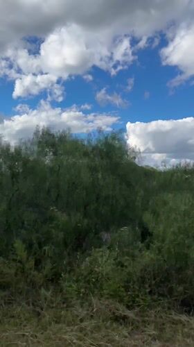 Blue lake and green hills captured in La Estancia