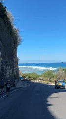 Cliff-hugging coastal road in Kuta Selatan with sea views