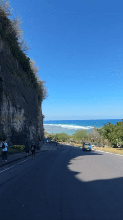 Cliff-hugging coastal road in Kuta Selatan with sea views