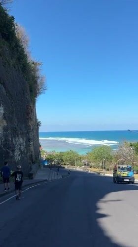 Cliff-hugging coastal road in Kuta Selatan with sea views