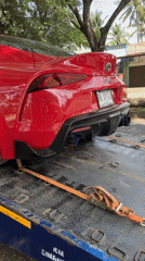 Modified Toyota Supra towed on roadside in Indonesia