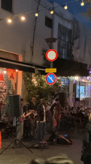 Evening street life bustles across Tel Aviv neighborhoods