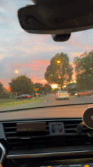 Driver stops at roundabout intersection in Mondercange, Luxembourg
