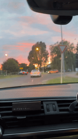 Driver stops at roundabout intersection in Mondercange, Luxembourg