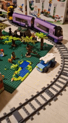 Elaborate LEGO city diorama with trains, vehicles, and Bowser