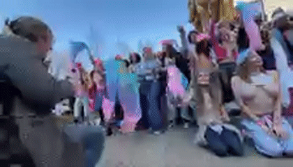 Topless women in berets demonstrate in NYC public square