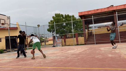 Young men play basketball at Lagos youth center court