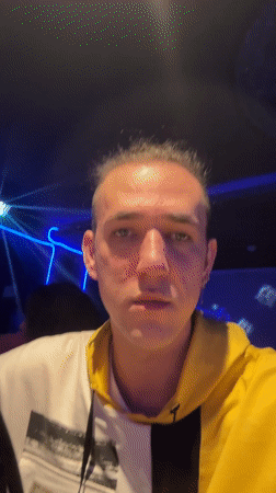 Karaoke performance captured in dimly lit Saratov venue