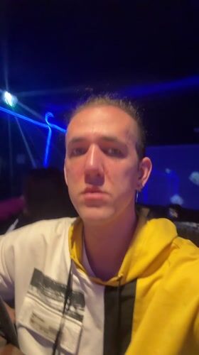 Karaoke performance captured in dimly lit Saratov venue