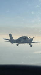 Single-engine aircraft in flight over Santa Barbara skies