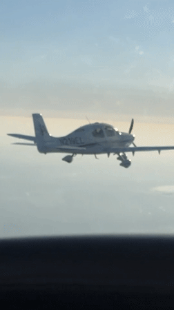 Single-engine aircraft in flight over Santa Barbara skies