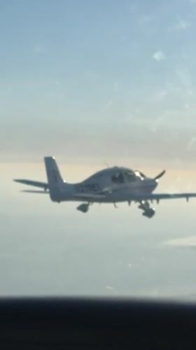 Single-engine aircraft in flight over Santa Barbara skies