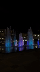Cherkessk fountain glows at night in purple and blue