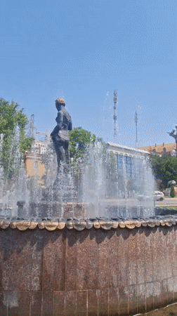 Morning documentation of Khujand's gardens, fountain statue, and theatre