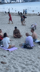 Beach gatherings and street traffic captured in Nha Trang