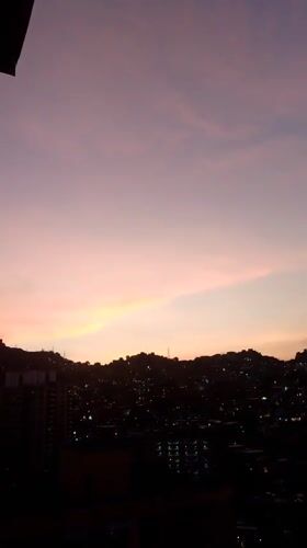 Dusk skyline captured over Caracas with colorful evening sky