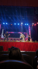 Staged event underway in Puebla with panel setup and spotlights