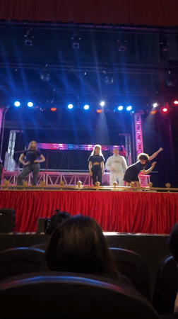 Staged event underway in Puebla with panel setup and spotlights