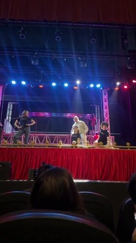 Staged event underway in Puebla with panel setup and spotlights