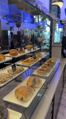 Inside a Weehawken café: pastry case and dining room