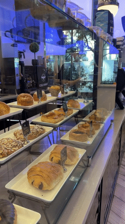 Inside a Weehawken café: pastry case and dining room