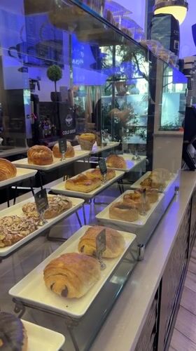 Inside a Weehawken café: pastry case and dining room
