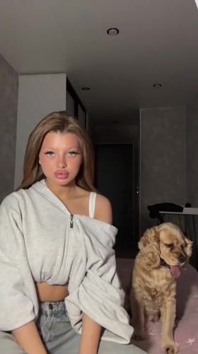 Woman and Cocker Spaniel captured in quiet domestic moment
