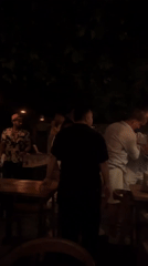Evening social gathering recorded at Kuta Selatan restaurant patio