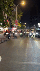 Tuk-tuk ride through a neon-lit Phnom Penh night