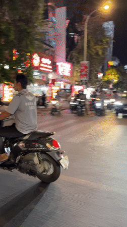 Tuk-tuk ride through a neon-lit Phnom Penh night