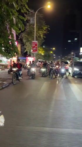 Tuk-tuk ride through a neon-lit Phnom Penh night