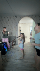Russian families enjoy karaoke, home painting projects Saturday afternoon