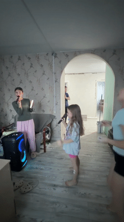 Russian families enjoy karaoke, home painting projects Saturday afternoon