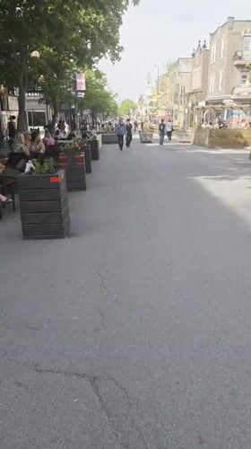 Outdoor dining scene captured on Montreal pedestrian street