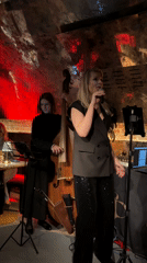 Woman performs with microphone at indoor Moscow venue
