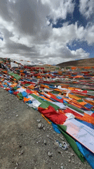 Visitors interact with Tibetan prayer flags in Hor town