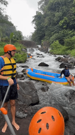 White water raft gets stuck on rocky Indonesian river