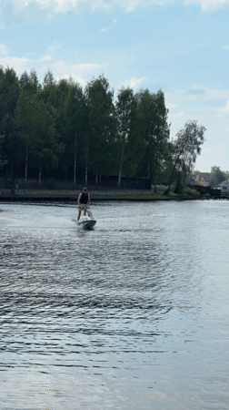 Man jet skis on lake in Shchelkovo, Russia