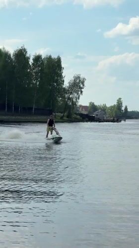 Man jet skis on lake in Shchelkovo, Russia