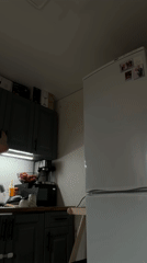 Woman documents morning hangover recovery routine in Russian kitchen