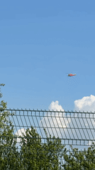 Red and white helicopter spotted flying over Lozen, Bulgaria