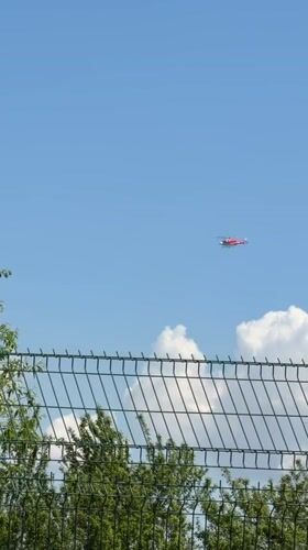 Red and white helicopter spotted flying over Lozen, Bulgaria