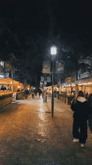 Evening street life documented around SuperStep store in Baku