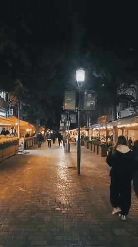 Evening street life documented around SuperStep store in Baku