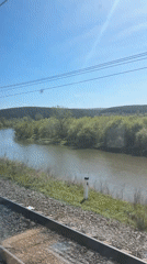 Train passenger documents scenic journey through Russian countryside