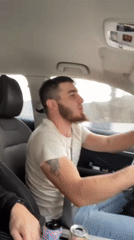 Bearded driver's musical road trip captured during sunrise hours