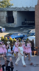 Youth dance groups perform in costume at Nesebar outdoor stage